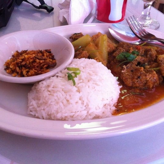 Photo taken at YoMa Burmese Restaurant by Joon L. on 6/24/2012