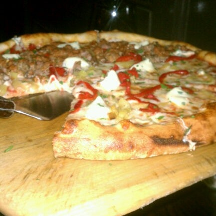 Photo taken at Rocco&#39;s Wood Fired Pizza by Adrian R. on 9/2/2012
