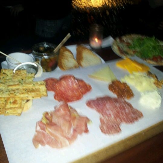 Photo taken at DOC Wine Bar by Therese M. on 2/4/2012