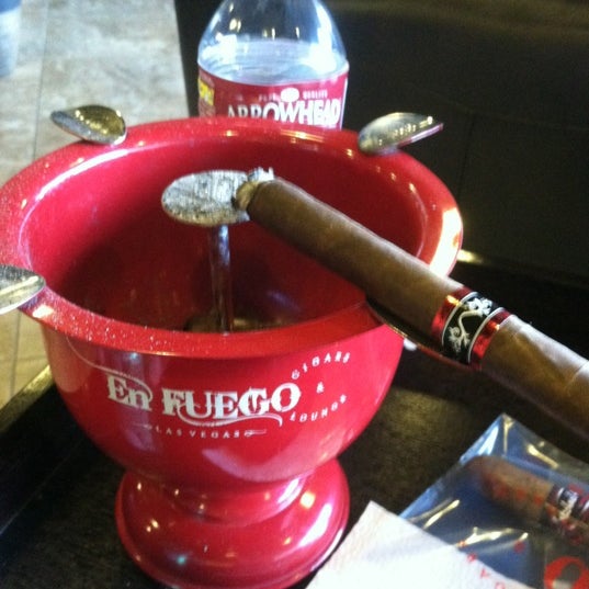 Photo taken at En Fuego Cigars &amp; Lounge by Brian K. on 8/8/2012