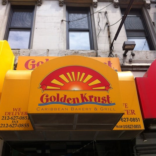 Photo taken at Golden Krust Caribbean Restaurant by Raul F. on 5/27/2012