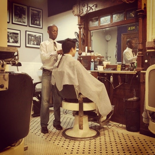 Photo taken at Neighborhood Cut and Shave Barber Shop by stephanie l. on 9/4/2012