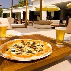 Treat yourself to tantalizing poolside refreshments by Wolfgang Puck, such as smoked salmon pizza with black caviar or tuna and salmon crudo, each paired with hand-selected specialty cocktails.