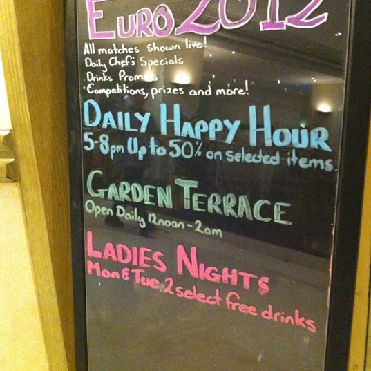 Photo taken at Harvester&#39;s Traditional Pub by Mar R. on 6/25/2012