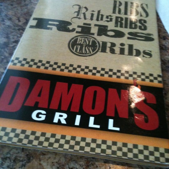 Photo taken at Damon&#39;s Grill by NELLY M. on 3/8/2012