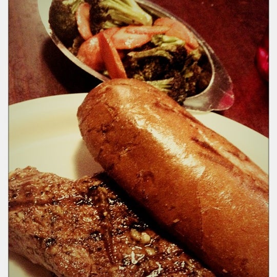 Photo taken at Grill Em Steak House &amp; Sports Bar by Nicolas N. on 3/10/2012
