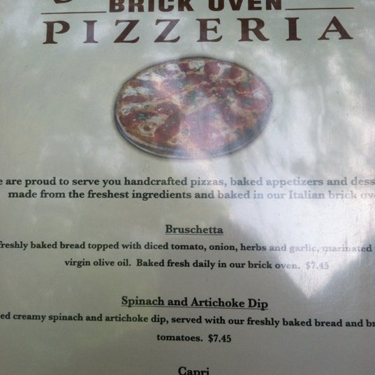Photo taken at Strong&#39;s Brick Oven Pizzeria by Daniel G. on 5/20/2012