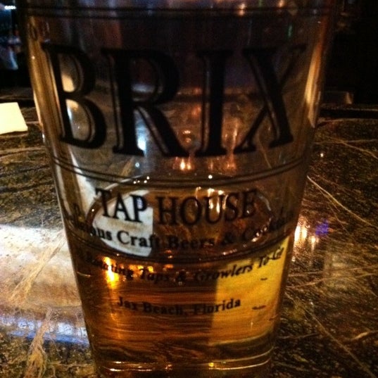 Photo taken at The Brix Taphouse by Christa C. on 4/25/2012