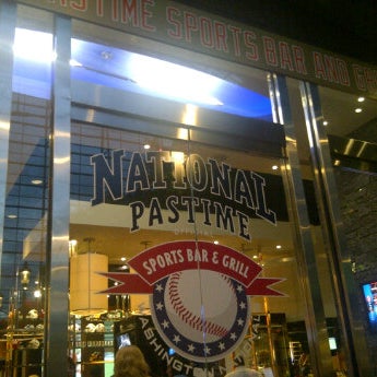 Photo taken at National Pastime Sports Bar &amp; Grill by Trixie S. on 7/23/2012