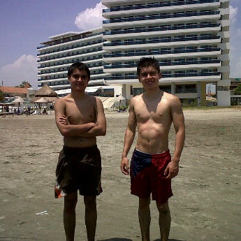 Photo taken at Playa Las Américas by Diana P. on 6/23/2012