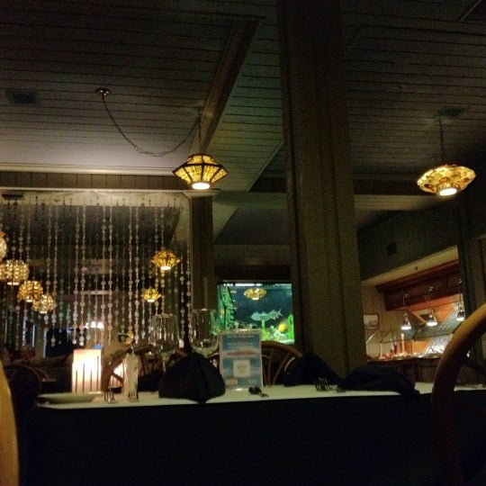 Photo taken at Ports O&#39; Call Waterfront Dining Restaurant by Sam K. on 3/4/2012