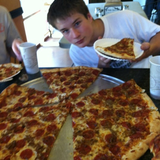 Photo taken at Nate&#39;s New York Pizza by Chuck E. on 6/3/2012
