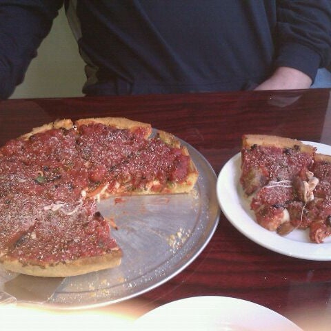 Photo taken at Kylie&#39;s Chicago Pizza by Sally M. on 5/6/2012