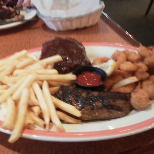 Photo taken at Sizzler by Tom S. on 7/26/2012