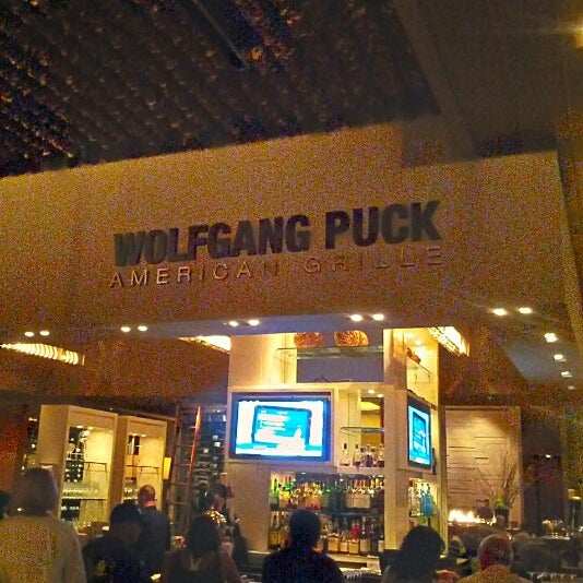 Photo taken at Wolfgang Puck American Grille by Joe T. on 6/9/2012
