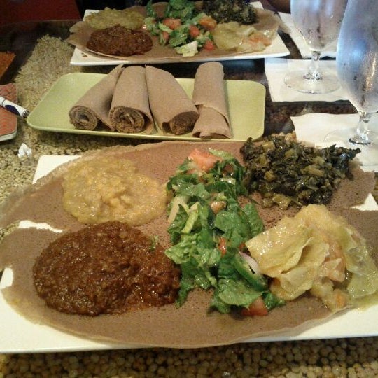 Photo taken at Queen of Sheba Ethiopian Restaurant by Edilburga G. on 4/1/2012