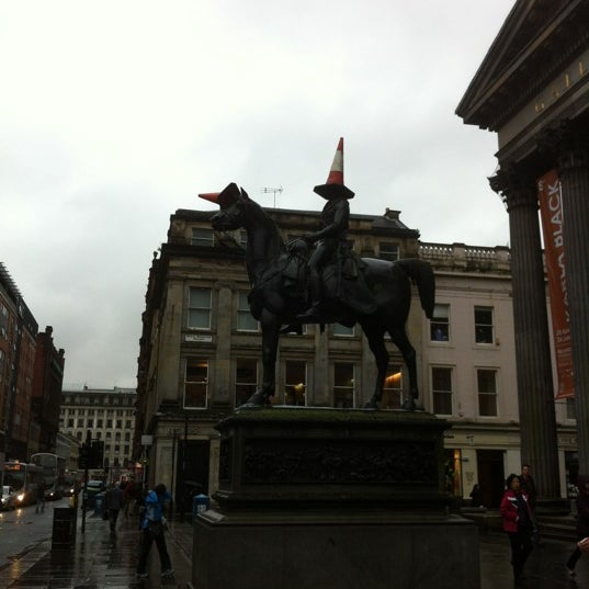 Photo taken at Royal Exchange Square by Ian G. on 6/22/2012