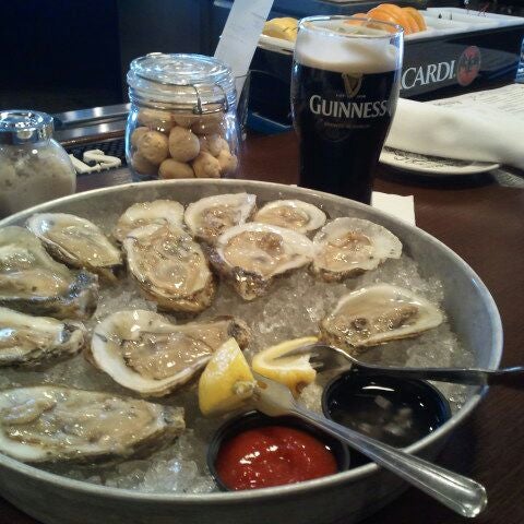 Photo taken at Doc Magrogan&#39;s Oyster House by Kristin O. on 4/11/2012
