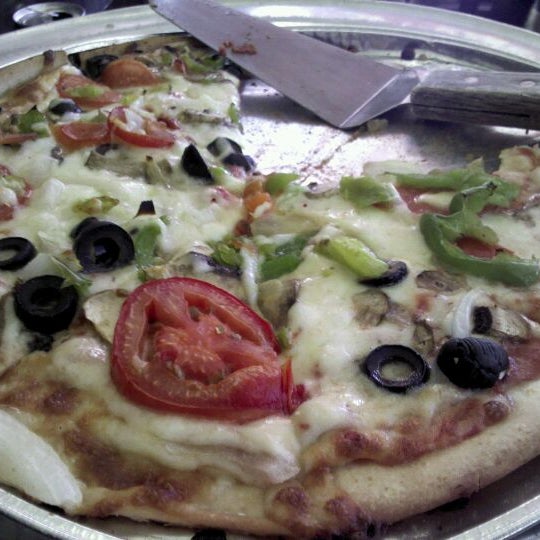 Photo taken at North Beach Pizza by Jennifer R. on 6/9/2012