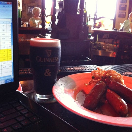 Photo taken at Slainte Irish Pub + Kitchen by Jim T. on 7/6/2012