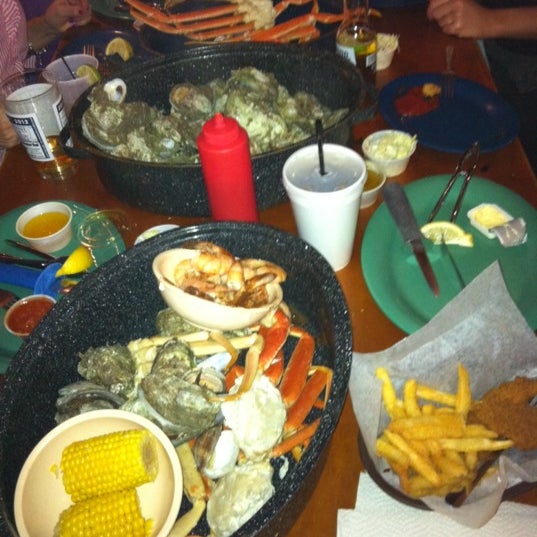 Photo taken at Bimini&#39;s Oyster Bar and Seafood Cafe by M B. on 2/12/2012