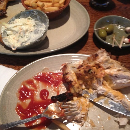 Photo taken at Nando&#39;s by Miles B. on 6/10/2012