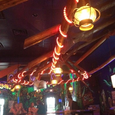 Photo taken at Gilligan&#39;s Tropical Bar &amp; Grill by Callie W. on 8/4/2012