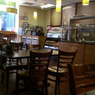 Photo taken at Zizi&#39;s Cafe by Candice K. on 8/11/2012