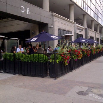 Photo taken at Oliver &amp; Bonacini Café Grill, Yonge and Front by Americo G. on 6/8/2012