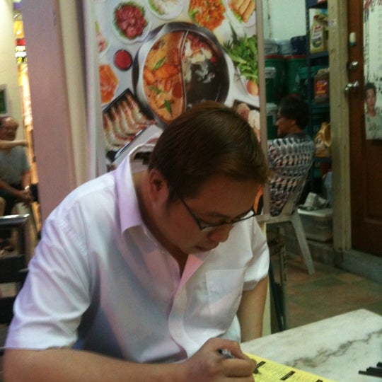 Photo taken at King&#39;s Laksa Steamboat by Andy L. on 3/12/2012