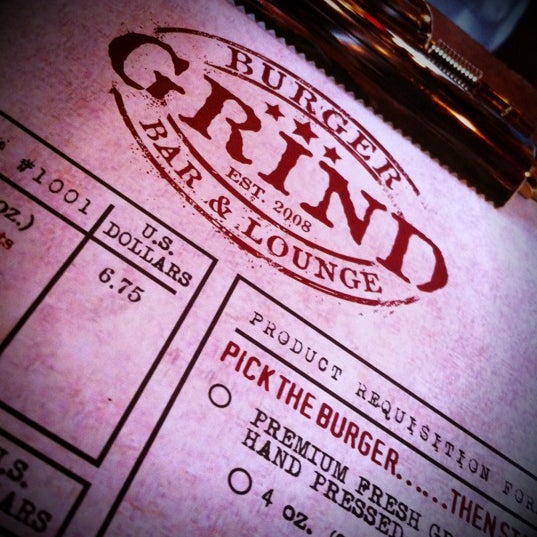 Photo taken at Grind Burger Bar &amp; Lounge by brandon on 7/22/2012