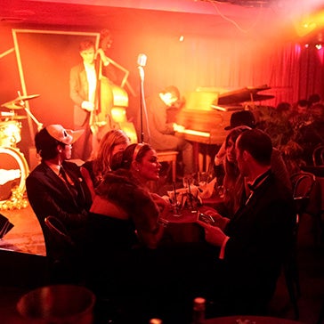 Time travel to Sleep No More's eerie-romantic after-hours hang. We can send you in VIP style (reserved table for 6, absinthe punch to go around) & see revivalist jazz of the era. Bring your friends! >