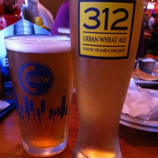 Photo taken at Crew Bar and Grill by Lesley S. on 3/22/2012
