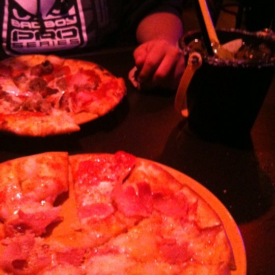 Photo taken at The Rock Wood Fired Pizza by Mercedes H. on 3/10/2012