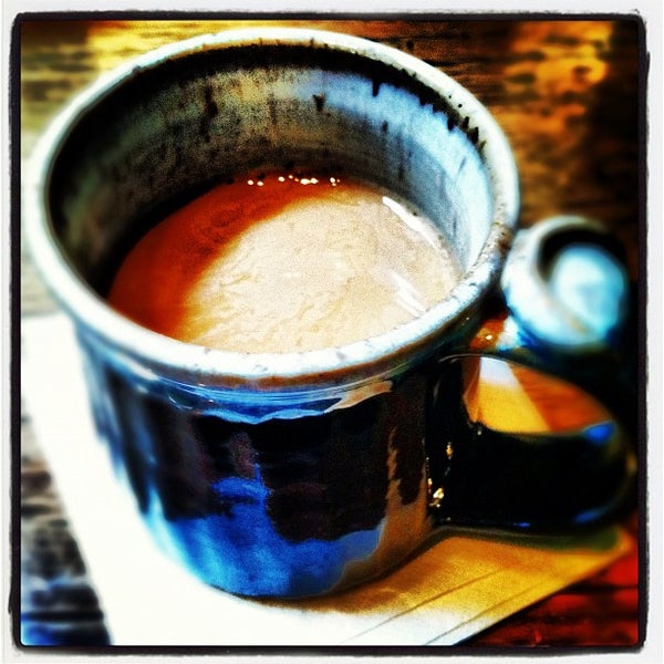 Photo taken at Central Coffee Company by Andrew N. on 3/9/2012