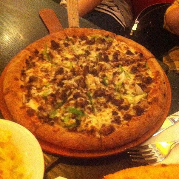 Photo taken at M Pizza by Jess H. on 6/15/2012