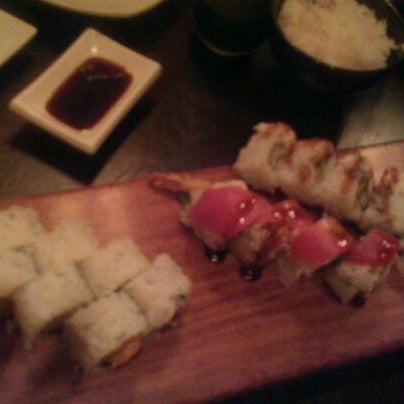 Photo taken at Okura Robata Sushi Bar and Grill by Thomas H. on 4/7/2012