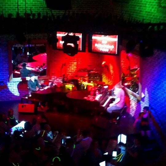 Photo taken at Bobby McKey&#39;s Dueling Piano Bar by Gina R. on 6/24/2012