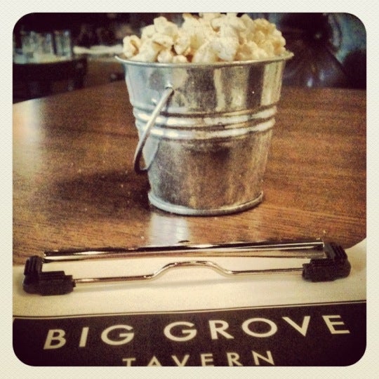 Photo taken at Big Grove Tavern by Ashley J. on 6/21/2012