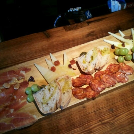 Photo taken at Salumi Tapas and Wine Bar by Joanne M. on 6/15/2012