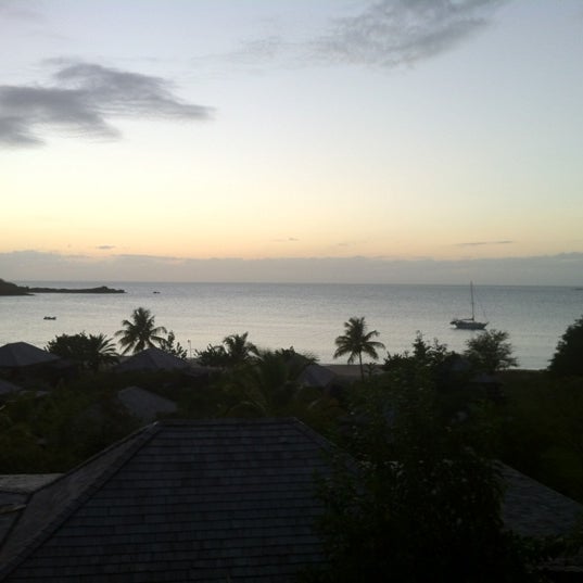 Photo taken at Hermitage Bay - Antigua by Den P. on 3/24/2012