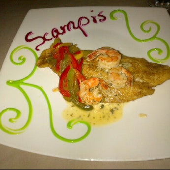 Photo taken at Scampi&#39;s Curacao by Steven D. on 6/11/2012