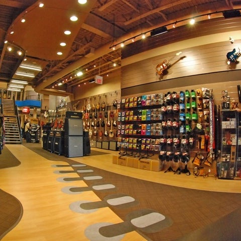 Photo taken at Cosmo Music - The Musical Instrument Superstore! by Christopher B. on 8/27/2012
