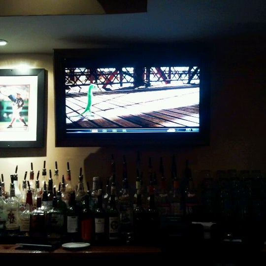 Photo taken at District 2 Bar &amp; Grille by Ilya K. on 3/8/2012