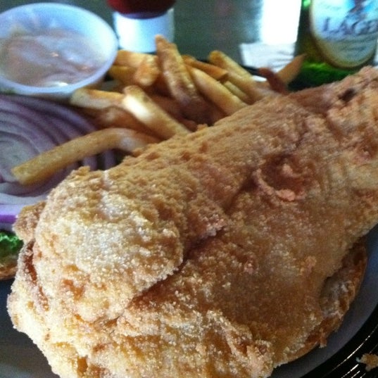 Photo taken at Hot Caboose Island Grille by Scott B. on 7/2/2012