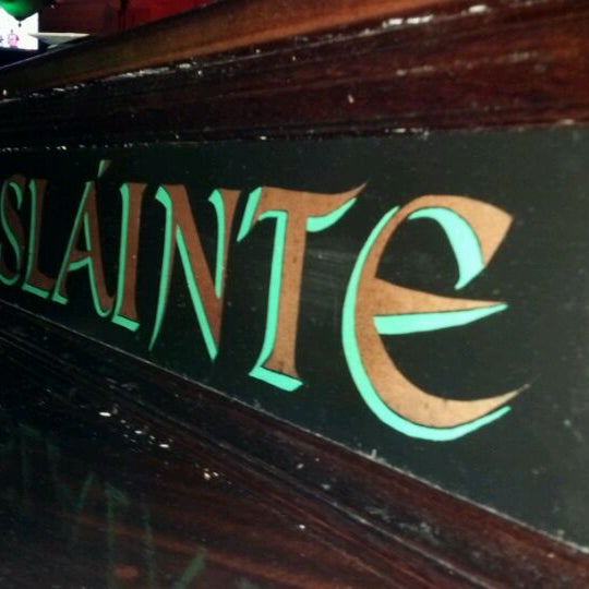 Photo taken at Slainte Irish Pub + Kitchen by brandon b. on 6/10/2012