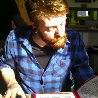 Photo taken at Brass Compass Cafe by Nicole C. on 2/14/2012