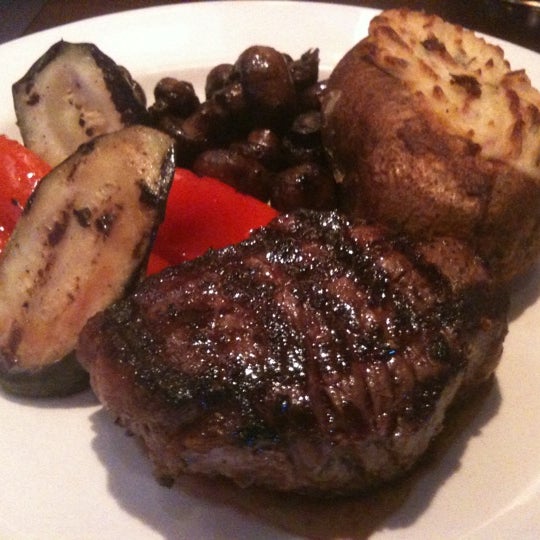 Photo taken at The Keg Steakhouse + Bar - Granville Island by Stephanie L. on 8/5/2012