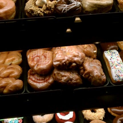 Photo taken at YoYo Donuts &amp; Coffee Bar by Stephanie R. on 8/15/2012