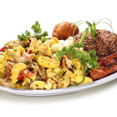Photo taken at Ackee Bamboo Jamaican Cuisine by Ackee B. on 3/21/2012